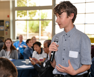 Student speaking at symposium